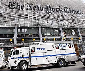 New York City police vehicles are seen outside the New York Times headquarters building in New York in this October 22, 2008 (File photo / Reuters)
