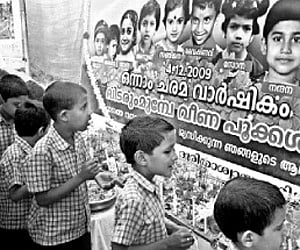 Children  of the Sree Narayana  Vilasam School at Perumannu in Kannur district offering floral  tributes to the memory of the 10 children killed in  t