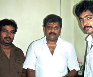 File photo of Union Minister for Shipping G K Vasan (C) releasing the audio CD of the Tamil movie on Cauvery water Thambivudiyan, as the lead actor of