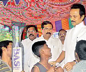 Deputy Chief Minister M K Stalin interacting with kids at the Puzhal Lankan refugee camp on Saturday.