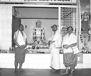 The idol of Prahladarayulu being taken out in a procession around the temple before the Maharathotsavam in Mantralayam on Sunday. (below) Priests at t