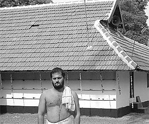 Subbaraju in front of the Sree Krishna Temple.