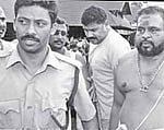 Kandararu Mohanaru and nephew Rahul Easwar on the Sabarimala temple premises after offering prayers on Monday.