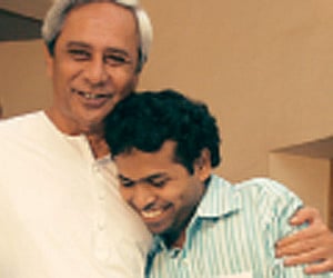 Chief Minister Naveen Patnaik greets Krishna Reddy of the Prince Dance Group that won the contest.
