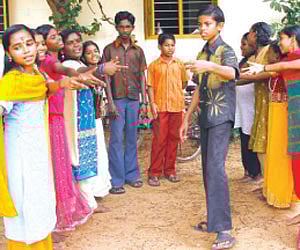 Minil Chandran practising folk songs with friends at Kalady Govt HS.