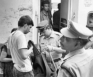 Police checking the luggage of passengers following a bomb threat at the Thampanoor railway station in Thiruvananthapuram.