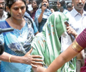 ESI director (C) M Ezhilarasi being brought to the Principal Sessions Court, in the city on Thursday.