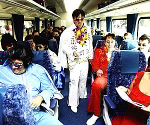 Elvis enthusiasts aboard the train in Sydney, Australia. (Photo: AP)