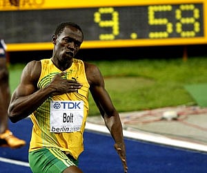 Jamaica's Usain Bolt celebrates setting a new Men's 100m World Record at the World Athletics Championships in Berlin on Sunday. (AP)