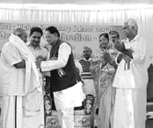 Poet ONV Kurup being honoured by Governor  R.S. Gavai at the centenary celebrations of Chavara Govt HSS which began on  Friday. ONV is an alumnus