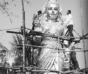 Workers giving final touches to the Bharata Mata statue at Hanuman Junction on Thursday/Pic: Ch Narayana Rao.