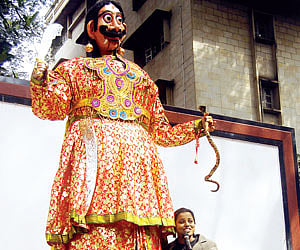 Indushree performing with Mahishasura, the 10-foot doll, with an eye on a world record.
