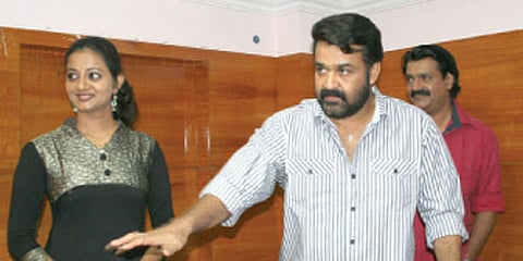 MINEFIELD IN PARADISE: Mohanlal, accompanied by co-stars Priyanka and Shankar, at the meet-the-press organised at the Press Club for the cast and crew