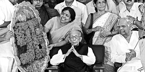 West Bengal Sports Minister Subhas Chakraborty (L) and former Lok Sabha Speaker Somnath Chatterjee with veteran CPM leader Jyoti Basu on his 96th birt