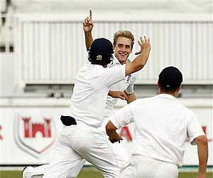 England's bowler Stuart Broad celebrates with teammates after dismissing  S Africa's batsman AB de Villiers on the fourth day of the Durban Test. AP