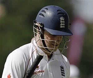 England's captain Andrew Strauss walks off the field after being caught out off the bowling of Jerome Taylor (Photo: AP)