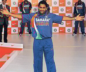 STRUTTING HIS STUFF: MS Dhoni displays India’s new ODI outfit on Wednesday ahead of the team’s departure for New Zealand.