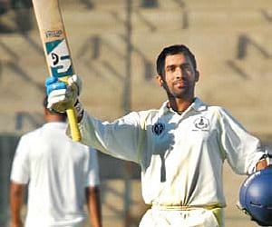 South Zone’s Dinesh Karthik celebrates his century against Central Zone in the Duleep Trophy in Bangalore on Saturday.