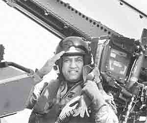 India’s first cosmonaut Wing Commander Rakesh Sharma salutes from the cockpit of an F-/A18 Super Hornett at the Aero India in Bangalore