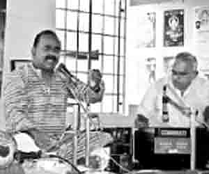 R Veeramani singing at the music appreciation class at Tharanganisari School of Music, Edappazhanji, on Saturday. Ramesh is on the dholak and V Rajago