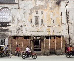 A public toilet being constructed along the wall of the Goshamahal Baradari building in Hyderabad.