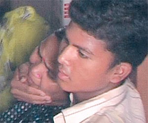 Slain SI Narsingha Mahakud's son and wife are inconsolable.