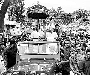Chief Minister V S Achuthanandan and Electricity Minister A K Balan travelling in an open jeep to attend the programme organised to declare Alathur As