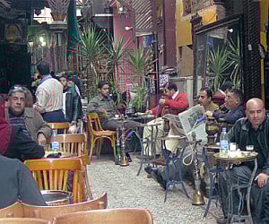 Clockwise from left: Sheeshas on sale in Cairo; woman making bread; the El Fishawy’s,  the oldest café inside the Khan al Khalili bazaar; the Mosque o
