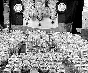 The 975 silver pots and 25 gold pots to be used for the Sahasrakalasam and Brahmakalasam rituals at the koothambalam of the Sree Krishna temple, Guruv