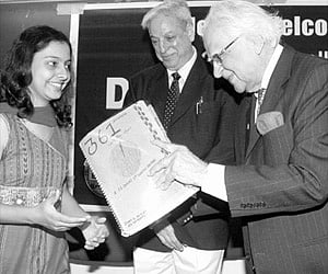 EFLU Chancellor Abid Hussain presenting an EFLU student with the manuscript magazine 361 degrees after releasing it on Friday. Vice-Chancellor Abhai M