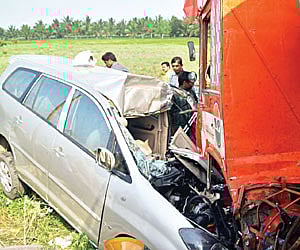 The mangled car of former DMK MLA Vasuki Murugesan that collided head on with a tanker at Sulur on Friday.
