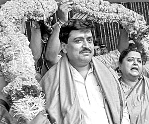 Maharashtra CM-designate Ashok Chavan with wife Ameeta during his 51st birthday celebration at his official residence in Mumbai on Wednesday.