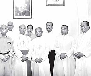 Verapoly Archbishop Daniel Acharuparambil and Auxiliary Bishop Joseph Karikkassery with priests and laymen who were conferred with papal honours.