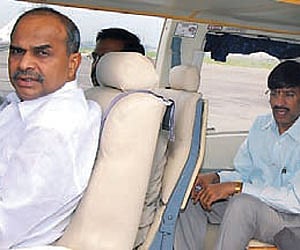 Chief Minister Y S Rajasekhara Reddy and Principal Secretary Subramanyam seated in Bell 430 helicopter before leaving for Chittoor.