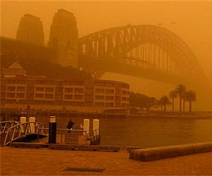 An almost unseen Sydney Harbour Bridge during a dust storm September 23, in Sydney. (AP)