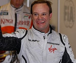 Rubens Barrichello celebrates after winning the pole position at the Interlagos race track in Sao Paulo. (Photo: AP)