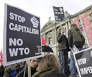 Anti-capitalism demonstrators participate during a protest against the World Trade Organisation in Geneva. (Photo: Reuters)