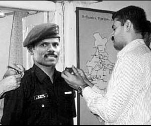 Captain R Murugaiyan being honoured with the Major rank