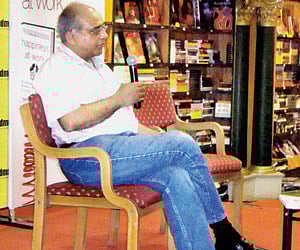 Cooperation Minister G Sudhakaran handing over a copy of ‘Amritabindukkal’, a poetry collection by M P Appan by Sahithya Pravarthaka Sahak.