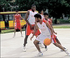 Action in the Hindustan College-SRM University match in the PBA inter-collegiate basketball tournament on Saturday
