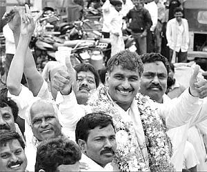 TRS winner T Harish Rao does a thumbs-up while celebrating his record-breaking victory in the Siddipet byelection on Friday.