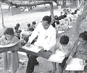 Mayor Ananta Jena, along with school children, taking part in a painting show on the eve of the World AIDS Day.