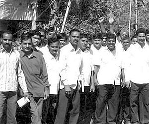 Nagesh Desai with his supporters campaigning for his wife Shubhangi, at Sambra recently | Express Photo