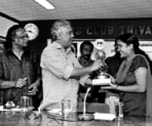 Forest Minister Binoy Viswam presenting the Swathi-Ayyappa  Panicker literary award to S V Aryambika in Thiruvananthapuram on Monday. ENS