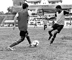 Young aspirants give everything even on an uneven surface during the trials for a  new professional club at the Maharaja’s College Stadium on Wednesda