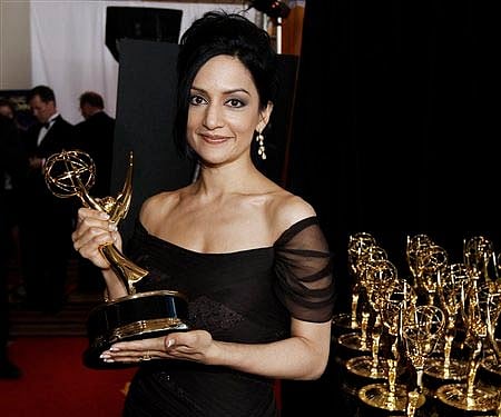 Archie Panjabi collects the award for best supporting actress for "The Good Wife" posing backstage during the Emmy Awards function in Los Angeles.(AP)