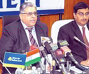 Indian Bank chairman and managing director T M Bhasin (centre) at a press conference in Chennai on Tuesday.