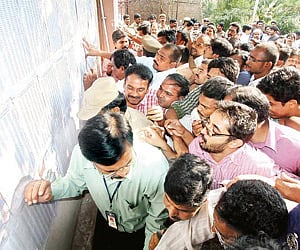 Candidates throng APPSC office in Hyderabad on Tuesday to check the results of Group I preliminary exam on display there. ENS