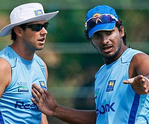 Lankan skipper Kumar Sangakkara discusses a point with trainer Jade Roberts during a training session in Dambulla on Tuesday. (AP)