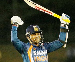 Virender Sehwag celebrates his 99 runs during India's match against Sri Lanka at Dambulla. AP